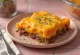 Pastelón con queso, servido, plato rico y delicioso