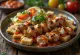 Yoğurtlu Kebab con brochetas de carne a la parrilla, salsa de tomate y yogur