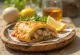 Empanada chilena de pescado, rellena de pescado al vino blanco, masa dorada